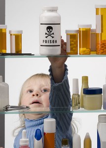 child reaching in medicine cabinet